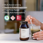 Equi Beauty Formula supplement  on table with award badges and green drink being stirred